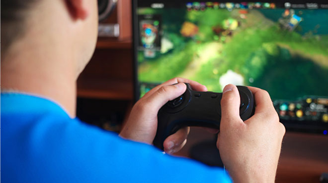 Man who plays a game using controller