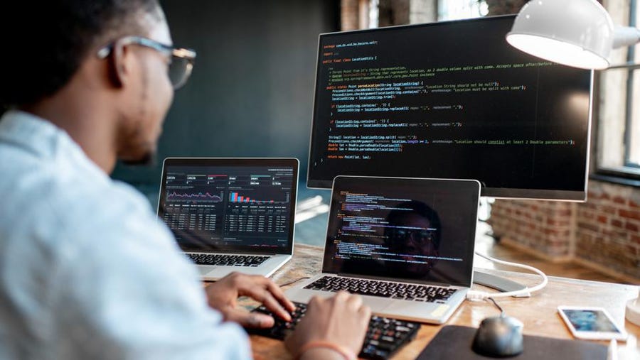 Man who program codes in laptop and PC